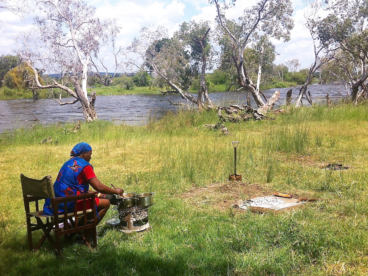 Adelina Banda cooking the wild mushroom risotto on her mbaula.